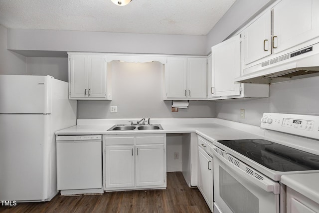 kitchen with white appliances, a textured ceiling, dark hardwood / wood-style flooring, white cabinetry, and sink