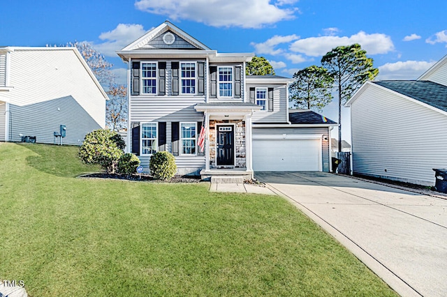 view of front of house with a garage and a front lawn