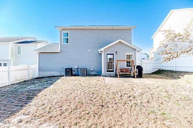 back of house with central AC unit and a patio area