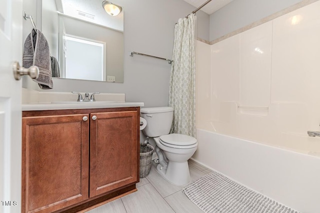 full bathroom with toilet, tile patterned flooring, vanity, and shower / bath combo with shower curtain