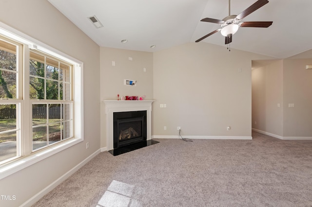 unfurnished living room featuring lofted ceiling, light carpet, and ceiling fan