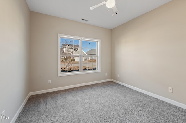 unfurnished room featuring ceiling fan and carpet floors