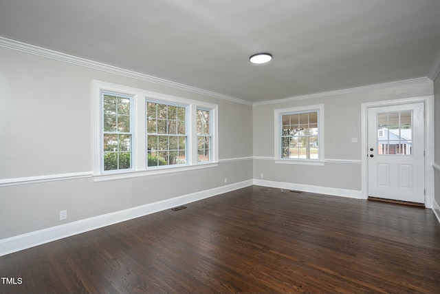 interior space featuring baseboards, visible vents, dark wood-type flooring, and ornamental molding