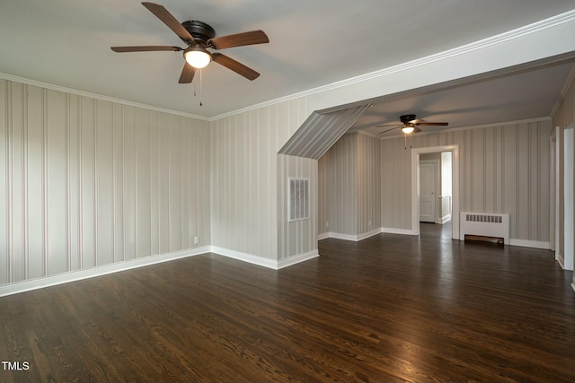 bonus room with radiator heating unit, visible vents, baseboards, and dark wood-style flooring