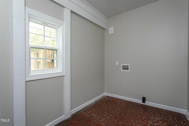 laundry area featuring laundry area, baseboards, and washer hookup