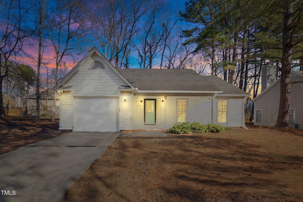 ranch-style house featuring a garage