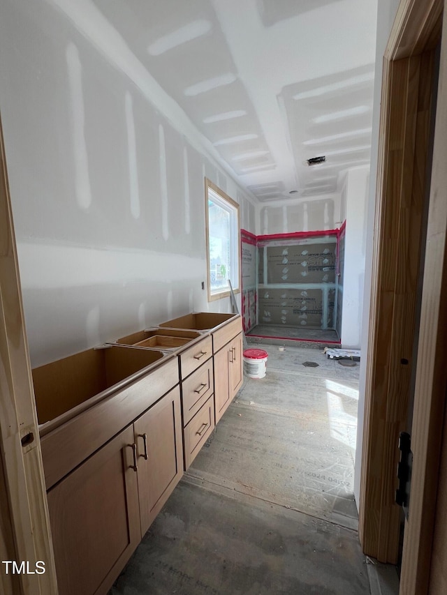 bathroom with concrete floors