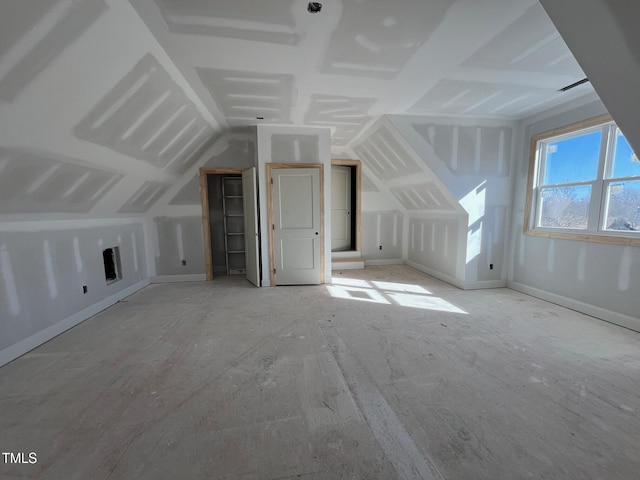 bonus room featuring lofted ceiling