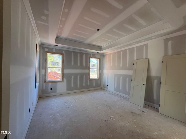 empty room featuring a tray ceiling