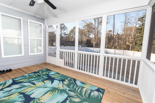 sunroom / solarium with ceiling fan