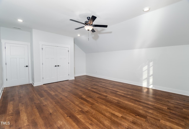 additional living space featuring ceiling fan, dark hardwood / wood-style floors, and vaulted ceiling