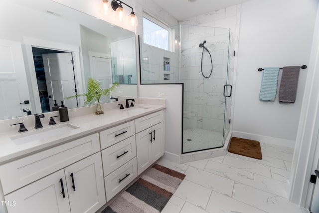 bathroom featuring vanity and a shower with door