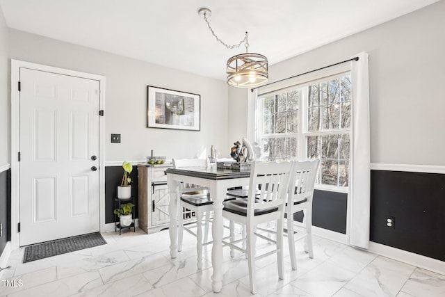 dining area featuring a chandelier