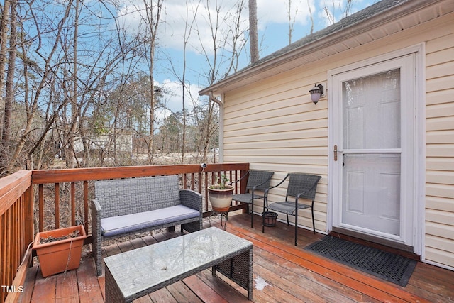 wooden deck featuring an outdoor hangout area