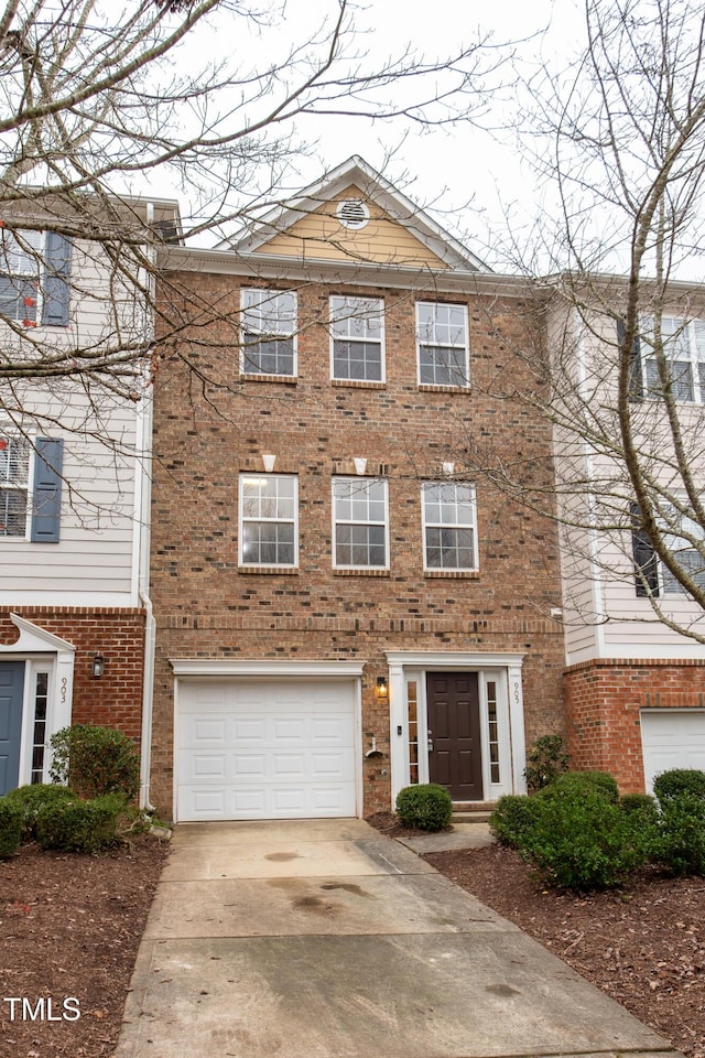 multi unit property featuring a garage