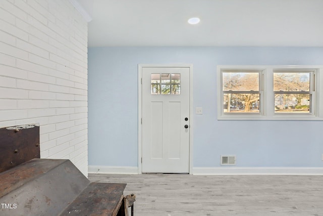 entrance foyer with light hardwood / wood-style flooring