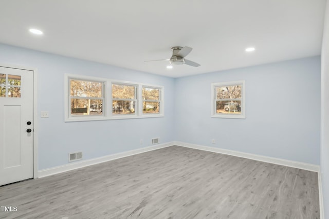 empty room featuring ceiling fan and light wood-type flooring