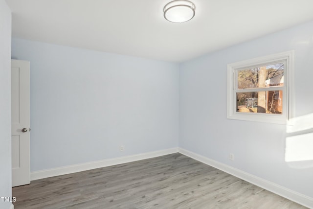 unfurnished room featuring wood-type flooring