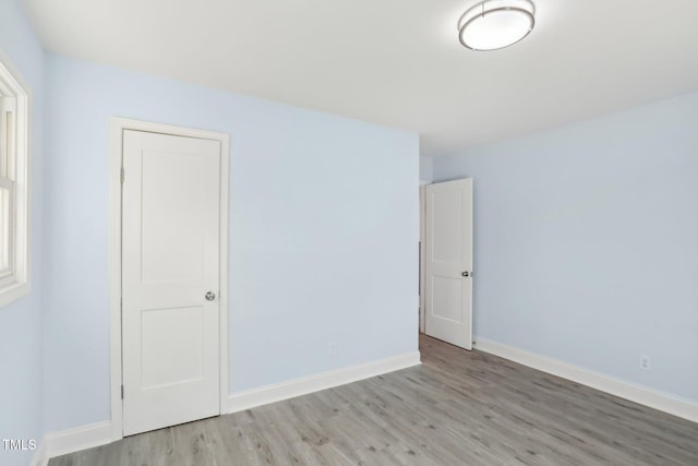 unfurnished room with light hardwood / wood-style flooring