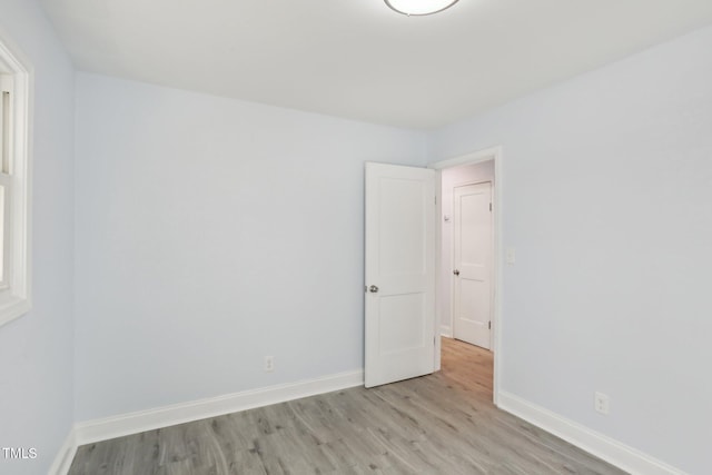 empty room with light hardwood / wood-style floors