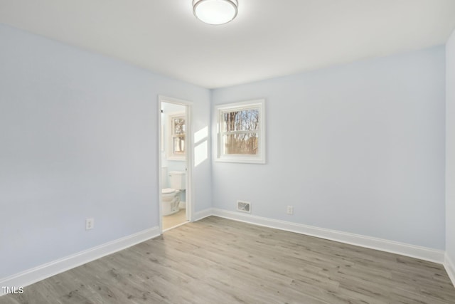 spare room with light hardwood / wood-style flooring