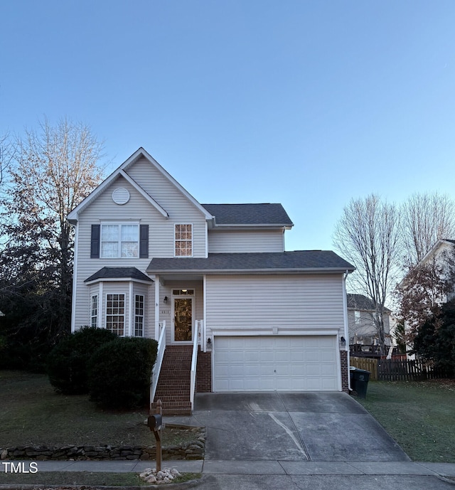 view of front property with a front yard and a garage