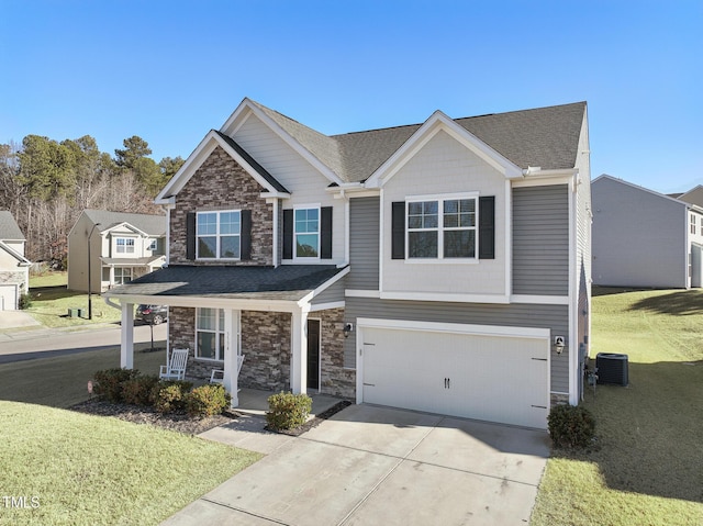 view of front of house with a garage, central AC unit, covered porch, and a front yard