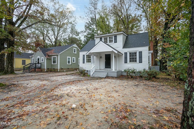 bungalow with a shingled roof and crawl space