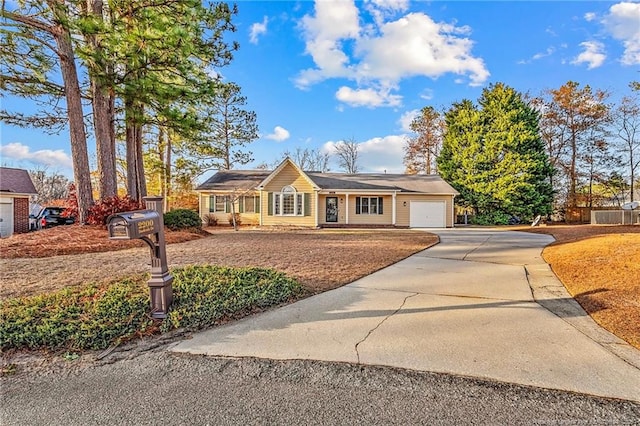 ranch-style home featuring a garage