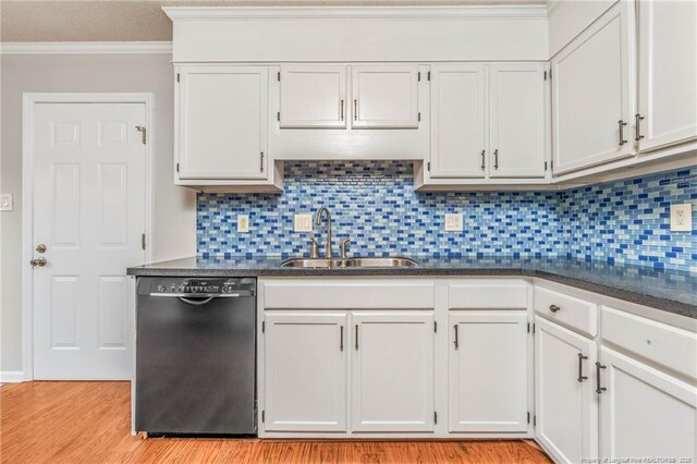 kitchen with sink, white cabinets, tasteful backsplash, and dishwasher