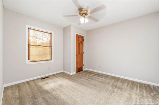 carpeted empty room with ceiling fan