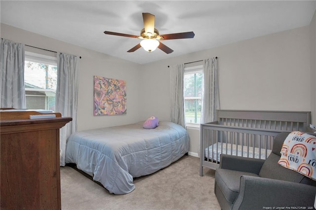 carpeted bedroom with ceiling fan