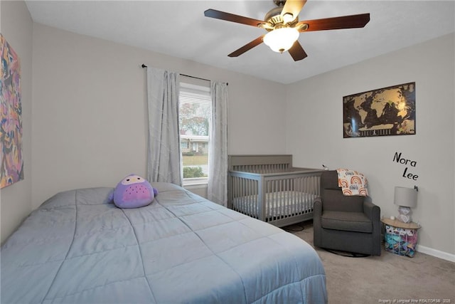 carpeted bedroom featuring ceiling fan