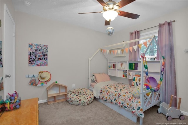 bedroom with ceiling fan and carpet floors