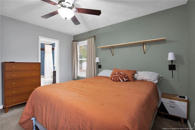 bedroom featuring ceiling fan, ensuite bath, and carpet