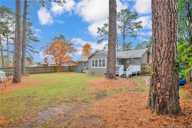 view of yard with a deck