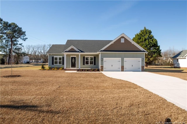 craftsman inspired home featuring a front lawn and a garage