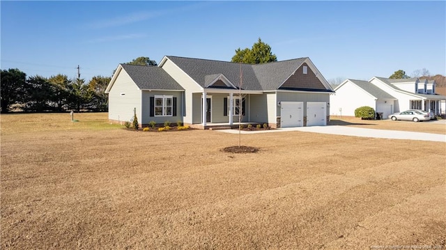 view of front facade with a garage and a front lawn