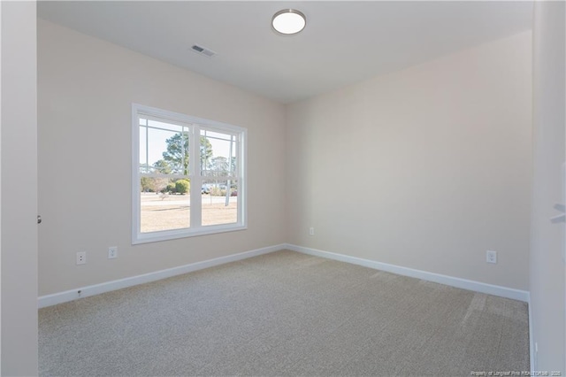 empty room featuring light carpet