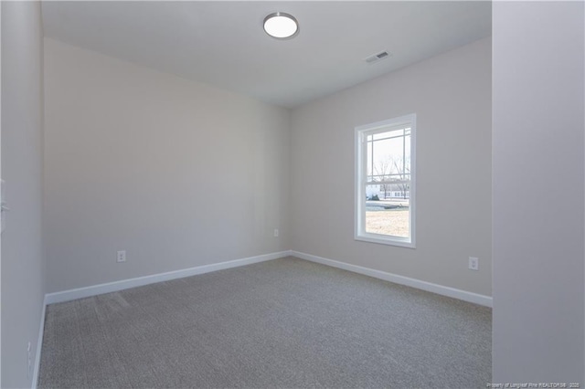 empty room featuring carpet floors