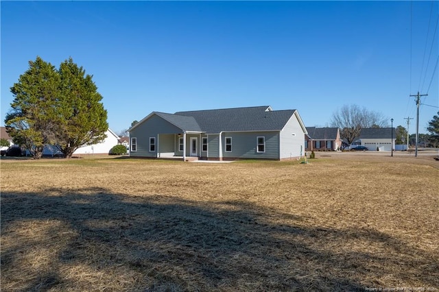 back of house with a yard