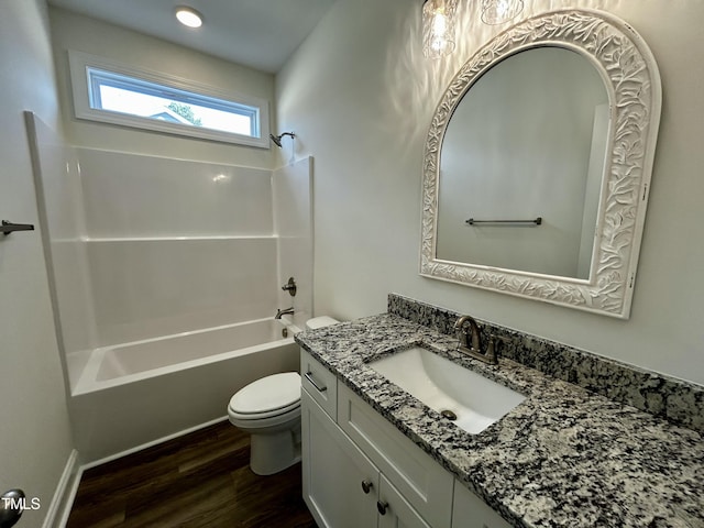 full bathroom featuring toilet, shower / tub combination, wood finished floors, and vanity