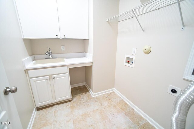 washroom featuring washer hookup, sink, cabinets, and hookup for an electric dryer