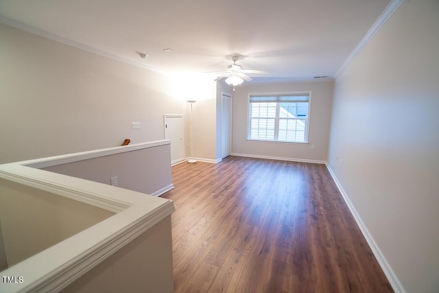 spare room with ceiling fan, ornamental molding, and hardwood / wood-style floors