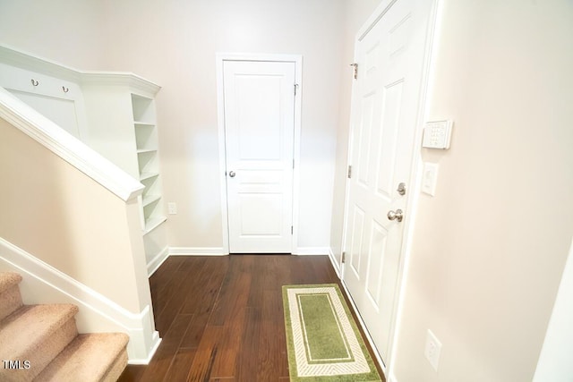 hall featuring dark wood-type flooring