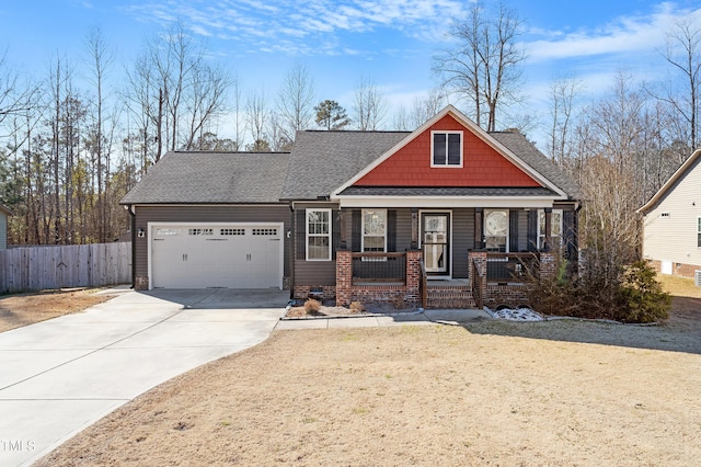 craftsman inspired home featuring covered porch and a garage