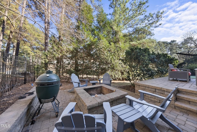 view of patio featuring an outdoor fire pit