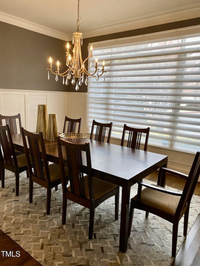 dining space featuring a chandelier, crown molding, and dark hardwood / wood-style floors