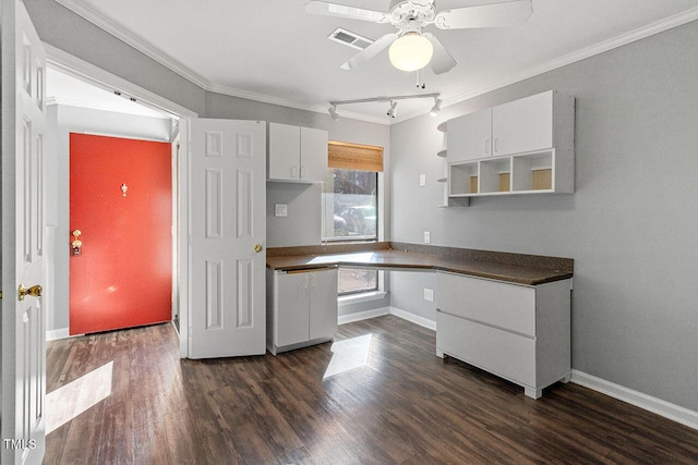 kitchen with white cabinets, ceiling fan, and crown molding