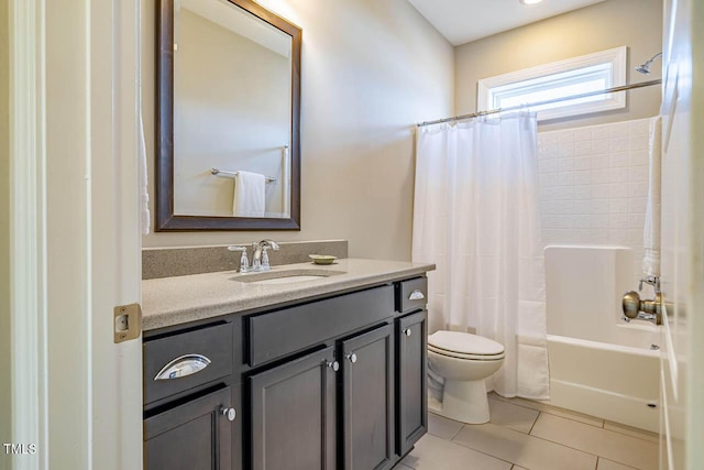 full bathroom with vanity, shower / tub combo, tile patterned floors, and toilet